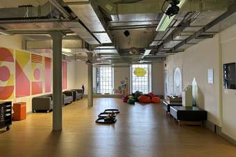 A photograph of the family space at Tate Liverpool which features building blocks, sofas and squashy bean bags