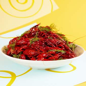 Photograph of a plate piled with crayfish
