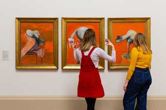Visitors at Tate Britain looking at a Francis Bacon painting