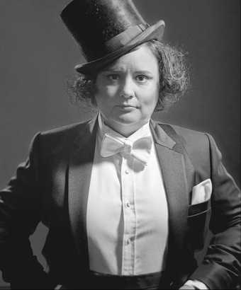 Susan Calman photographed in black and white wearing a top hat
